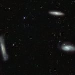 Triplet  of bright galaxies in the constellation of Leo (The Lion), together  with a multitude of fainter objects: distant background galaxies and  much closer Milky Way stars. The image hints at the power of the VST and  OmegaCAM for surveying the extragalactic Universe and for mapping the  low brightness objects of the galactic halo. This image is a composite  created by combining exposures taken through three different filters.  Light that passed through a near-infrared filter was coloured red, light  in the red part of the spectrum is coloured green, and green light is  coloured magenta.